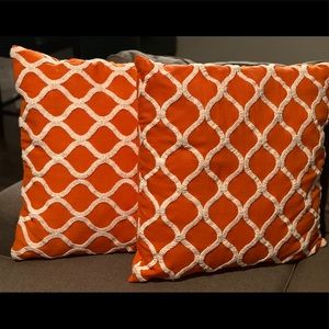 2 Large orange geometric pillows